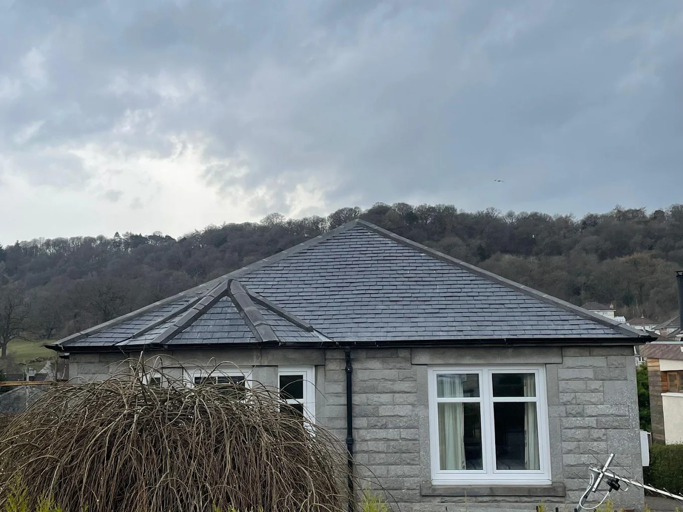Finished slate roof on a detached bungalow